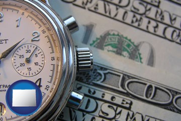 hourly payroll symbols - a stopwatch and paper money - with Colorado icon